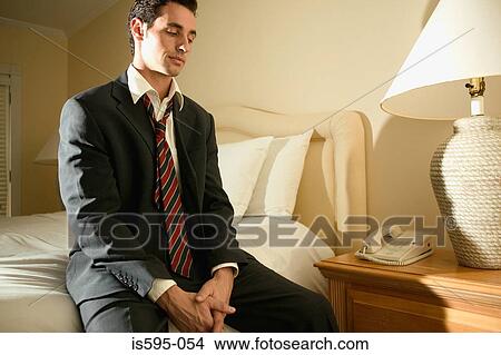 Businessman sitting in hotel room View Large Photo Image Picture - Businessman sitting in hotel room. Fotosearch