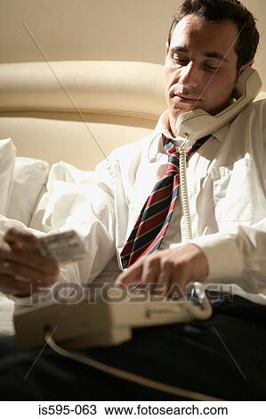 Businessman using telephone View Large Photo Image Stock Image - Businessman using telephone. Fotosearch