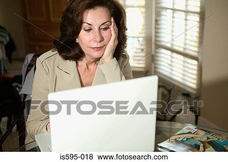Businesswoman using laptop computer View Large Photo Image Stock Photo - Businesswoman using laptop computer. Fotosearch