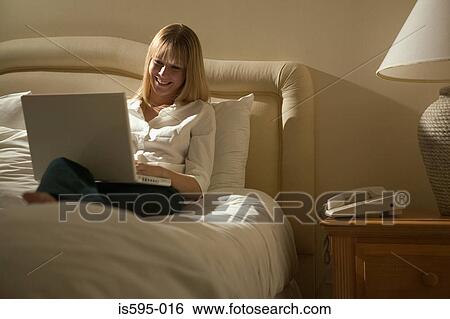 Stock Photograph - Businesswoman using laptop computer. Fotosearch