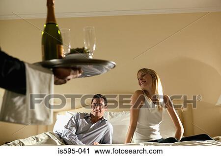 Stock Image - Couple receiving room service. Fotosearch