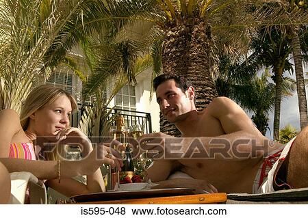 Couple toasting on honeymoon View Large Photo Image Stock Photo - Couple toasting on honeymoon. Fotosearch