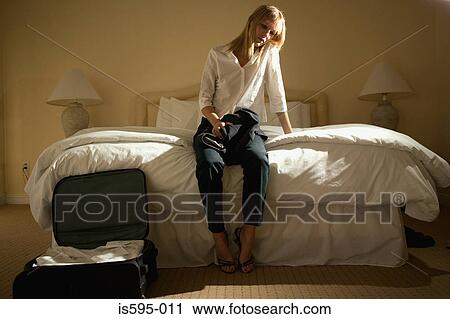 Lonely woman in hotel room View Large Photo Image Stock Image - Lonely woman in hotel room. Fotosearch