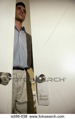 Man opening hotel door View Large Photo Image Stock Photo - Man opening hotel door. Fotosearch