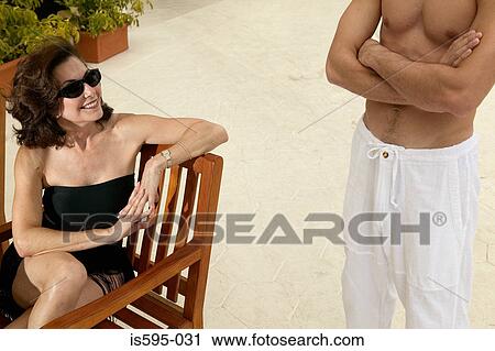 Mature woman and young man on vacation View Large Photo Image Stock Image - Mature woman and young man on vacation. Fotosearch