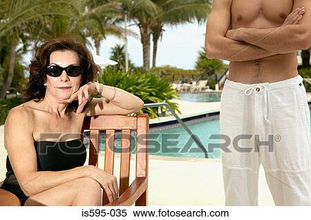 Mature woman and young man on vacation Stock Photography ...