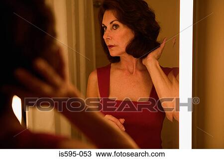 Woman looking in mirror View Large Photo Image Stock Image - Woman looking in mirror. Fotosearch