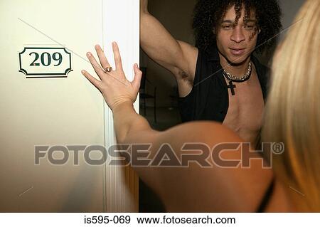 Young couple in hotel doorway View Large Photo Image Stock Photo - Young couple in hotel doorway. Fotosearch