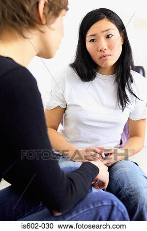 Female friends on sofa View Large Photo Image Stock Image - Female friends on sofa. Fotosearch