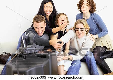 Friends watching television View Large Photo Image Stock Image - Friends watching television. Fotosearch