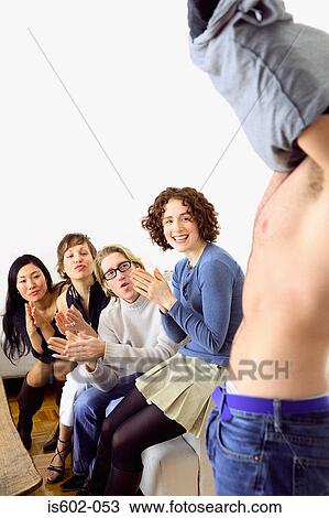 Man undressing in front of friends View Large Photo Image Stock Image - Man undressing in front of friends. Fotosearch