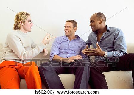 Men talking on sofa View Large Photo Image Stock Photo - Men talking on sofa. Fotosearch