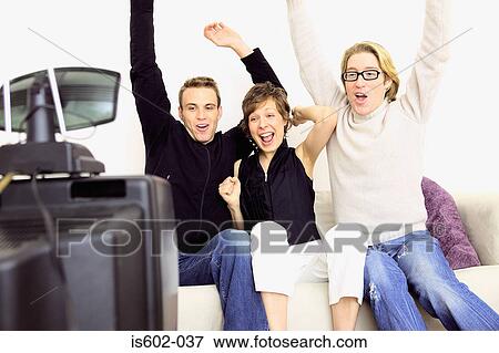 People celebrating on sofa View Large Photo Image Stock Photo - People celebrating on sofa. Fotosearch