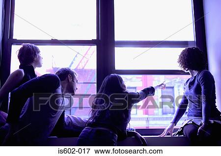 Silhouetted people at window View Large Photo Image Stock Photo - Silhouetted people at window. Fotosearch