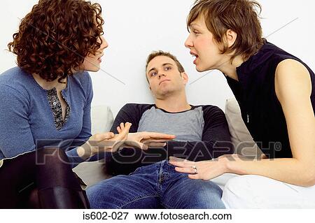Stock Photo - Women arguing on sofa. Fotosearch