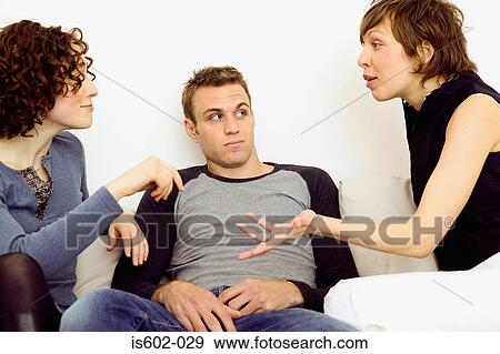 Stock Photo - Women arguing on sofa. Fotosearch