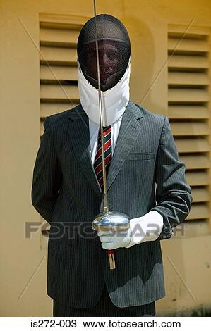 Stock Image - Businessman fencing. Fotosearch