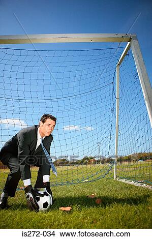 Picture - Businessman in goal. Fotosearch