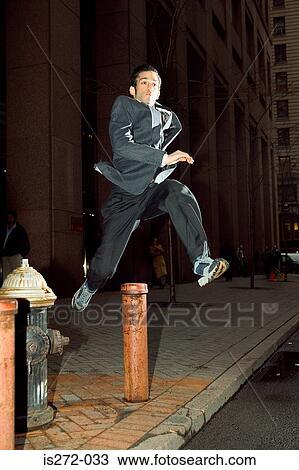 Businessman running through city View Large Photo Image Stock Image - Businessman running through city. Fotosearch