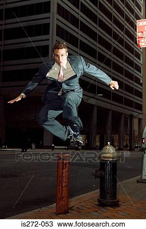 Businessman running through city View Large Photo Image Stock Image - Businessman running through city. Fotosearch