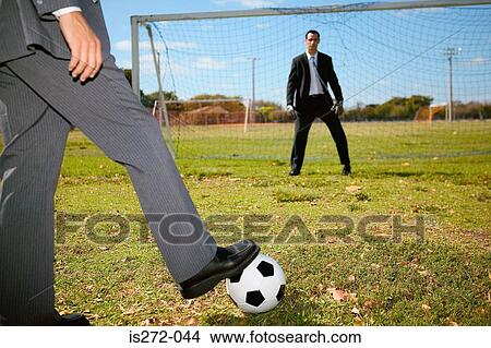 Businessman taking a penalty View Large Photo Image Picture - Businessman taking a penalty. Fotosearch