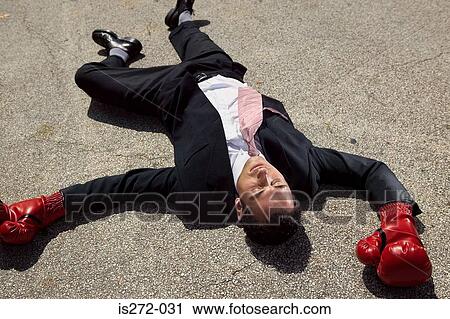 Businessman unconscious on floor View Large Photo Image Stock Image - Businessman unconscious on floor. Fotosearch