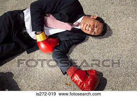 Businessman unconscious on floor View Large Photo Image Stock Photo - Businessman unconscious on floor. Fotosearch