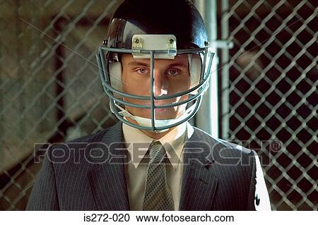 Businessman wearing american football helmet View Large Photo Image Stock Image - Businessman wearing american football helmet. Fotosearch