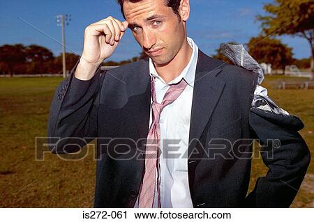 Businessman with a torn suit View Large Photo Image Stock Image - Businessman with a torn suit. Fotosearch