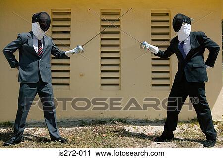 Businessmen fencing View Large Photo Image Stock Image - Businessmen fencing. Fotosearch