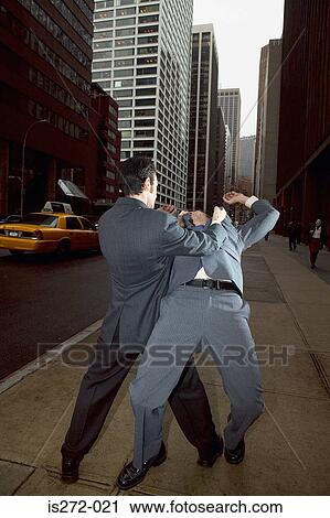 Businessmen fighting in street View Large Photo Image Stock Image - Businessmen fighting in street. Fotosearch