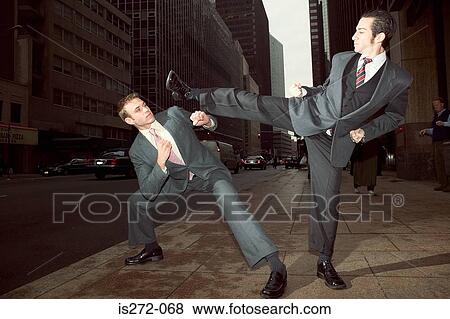 Businessmen fighting in street View Large Photo Image Stock Photo - Businessmen fighting in street. Fotosearch