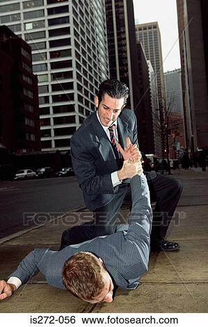 Businessmen fighting in street View Large Photo Image Stock Photograph - Businessmen fighting in street. Fotosearch