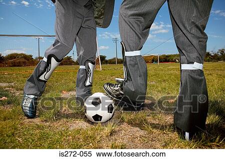 Businessmen playing football View Large Photo Image Stock Photography - Businessmen playing football. Fotosearch