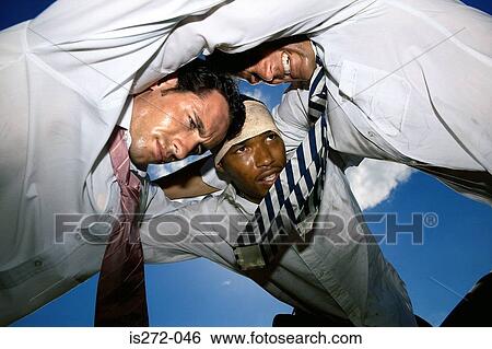 Stock Photograph - Businessmen playing rugby. Fotosearch