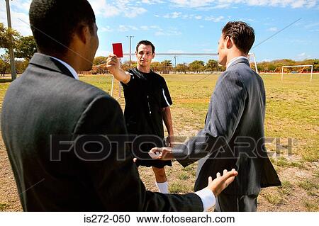 Referee holding a red card View Large Photo Image Stock Image - Referee holding a red card. Fotosearch