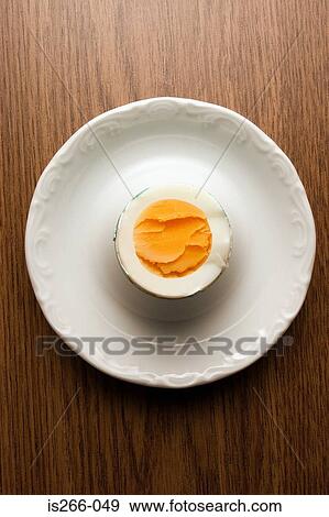 Hard boiled egg on table View Large Photo Image Stock Photo - Hard boiled egg on table. Fotosearch
