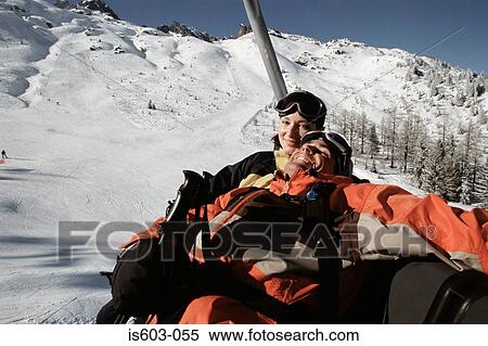 Couple on a ski lift View Large Photo Image Stock Photography - Couple on a ski lift. Fotosearch