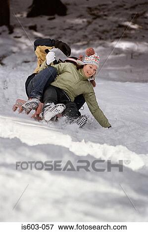 Couple playing in snow View Large Photo Image Stock Photo - Couple playing in snow. Fotosearch