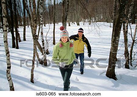 Couple playing in snow View Large Photo Image Stock Photography - Couple playing in snow. Fotosearch