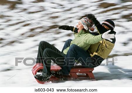 Couple riding a sleigh View Large Photo Image Stock Image - Couple riding a sleigh. Fotosearch