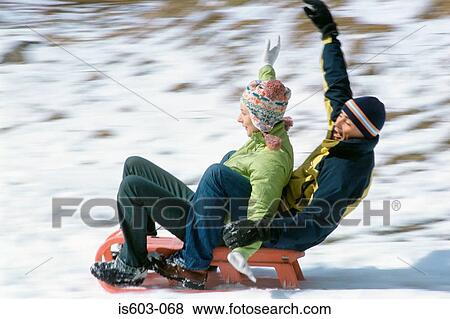 Stock Photo - Couple riding a sleigh. Fotosearch