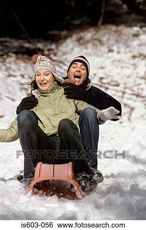 Couple riding a sleigh View Large Photo Image Stock Photograph - Couple riding a sleigh. Fotosearch