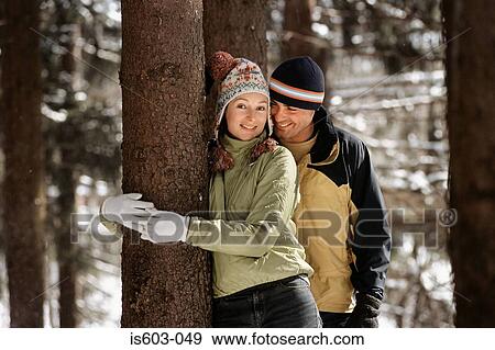 Smiling couple in forest View Large Photo Image Stock Photo - Smiling couple in forest. Fotosearch