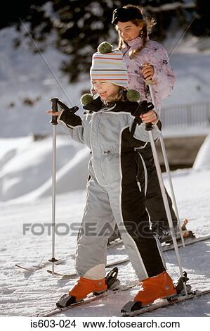 Two girls skiing View Large Photo Image Picture - Two girls skiing. Fotosearch
