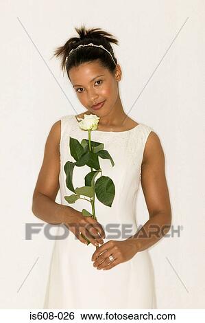 Bride holding a white rose View Large Photo Image Stock Photograph - Bride holding a white rose. Fotosearch
