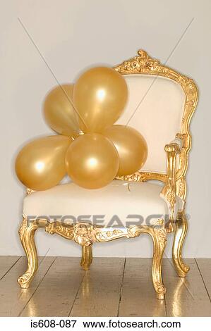 Bunch of balloons on armchair View Large Photo Image Stock Photo - Bunch of balloons on armchair. Fotosearch