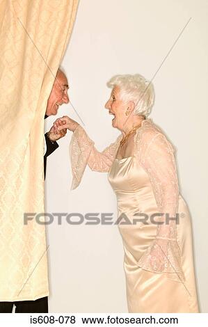 Man kissing a senior womans hand View Large Photo Image Stock Photo - Man kissing a senior womans hand. Fotosearch