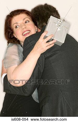 Mature couple hugging View Large Photo Image Picture - Mature couple hugging. Fotosearch