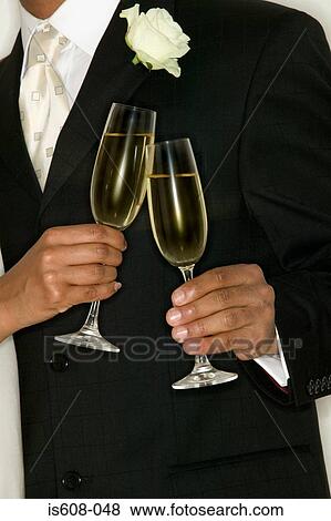 Stock Photo - Newlywed couple toasting. Fotosearch